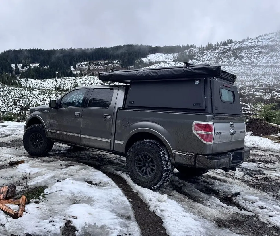 4x4 pickup truck driving in deep snow