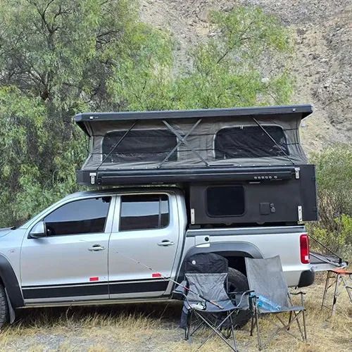 full overland campsite setup with truck and chairs