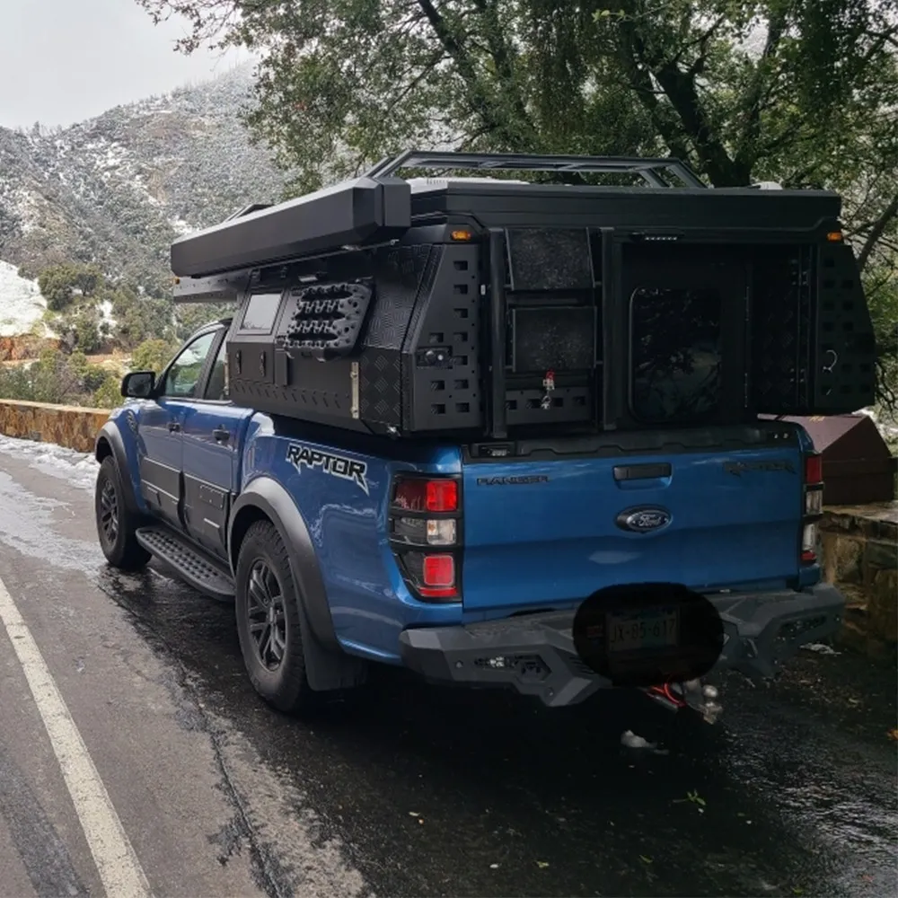 rear view of overland truck with swing out tire carrier