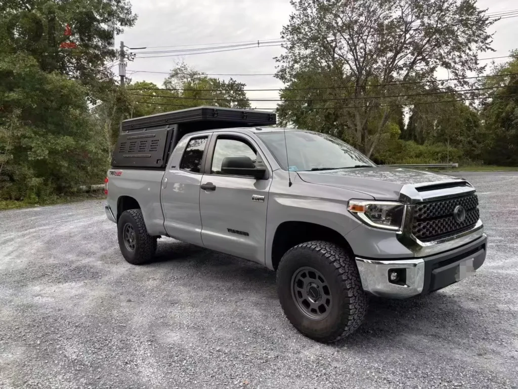 silver toyota tacoma overland build with bed cap